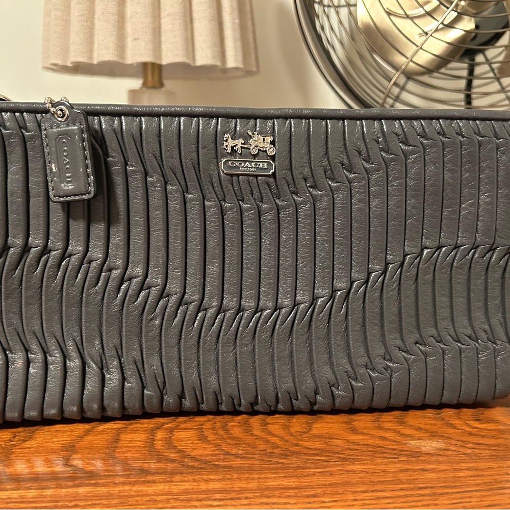 Coach Vintage Metallic Gray wristlet.